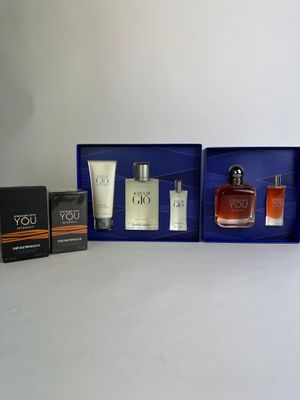 a couple of bottles of perfume sitting on top of a table