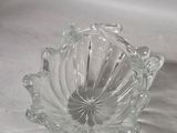 a clear glass bowl on a white table cloth