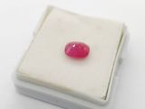 pink ruby gems in a white box on a white surface