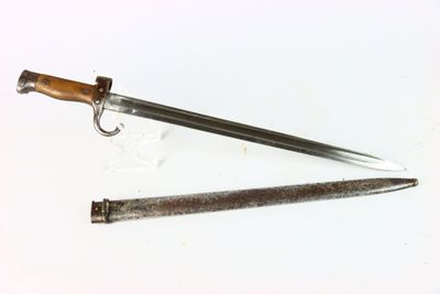a knife and a knife holder on a white surface