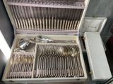 a case with silverware inside of it on a table