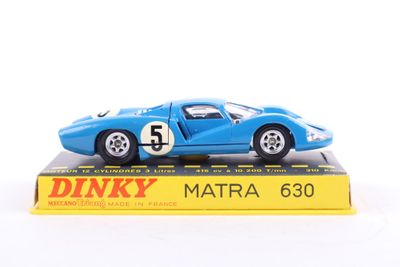 a blue toy car sitting on top of a yellow box