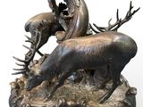bronze sculpture of a deer and antelope on a base