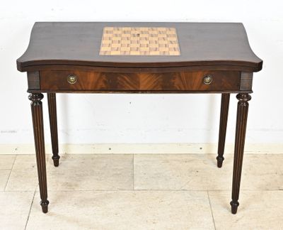 an old wooden table with a chess board on top of it