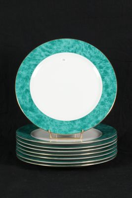 five plates stacked on top of each other on a black background