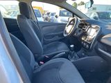 the interior of a car with black seats and a steering wheel