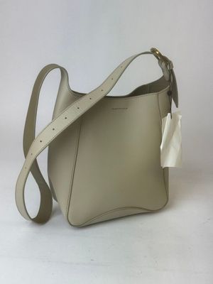 a white purse with a white bow on the handle