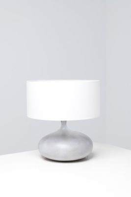 an image of a white table lamp on a white surface