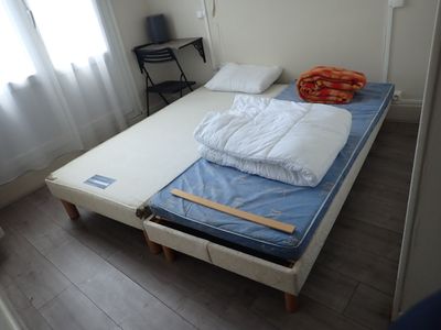 a bed that has a mattress and a pillow on it
