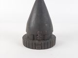 an image of a small metal cone on a white surface