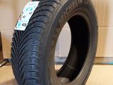 a close up of a tire on a cardboard box in a room