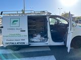 a white van that is parked in the parking lot