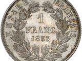 a close up of a coin with a wreath on it