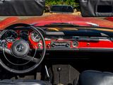 a red and black car with a steering wheel and dashboard