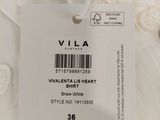 the label on a white shirt is attached to a tag