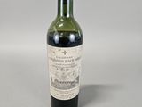 a bottle of wine that is sitting on a table