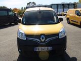 yellow and black van parked in a parking lot next to other vehicles