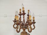 a gold colored chandelier with five lights on it