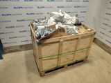 a wooden crate with a bunch of nuts on top of it