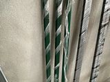 several skis are lined up against a wall in a room