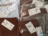 a lot of clothes that are wrapped in plastic bags