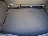 a trunk of a car with the back seats folded down