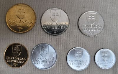 six different coins of different countries are shown on a table