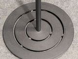 an image of a black umbrella stand on the ground