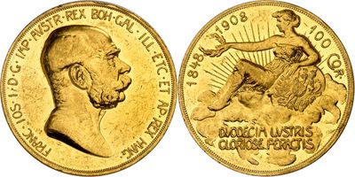 a close up of a gold coin with a man on it