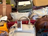 a lot of purses on a table in a store