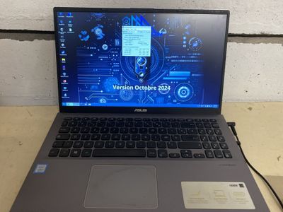 a laptop that is sitting on a table with a mouse