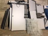 a pile of assorted metal items in a room