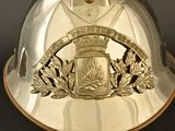 a silver helmet with a crest on it