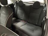 the back seats of a car are black and grey in color