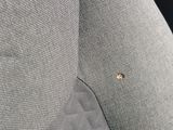 a small piece of fabric on the back of a car seat