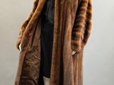 a woman ' s brown fur coat on a mannequin mannequin mannequin mannequin mannequin mannequin mannequin manne