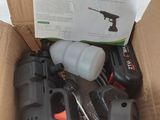a box with a gun, a spray bottle, a spray can, and other tools in it