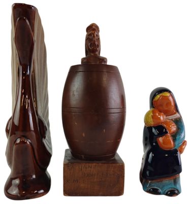 three figurines that are sitting next to each other