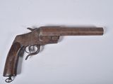 a close up of a gun on a white surface with a white background