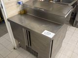 a stainless steel sink in a kitchen with a lot of counter space