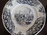 a black and white plate with a picture on it
