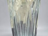 a glass vase that is sitting on a table