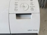 a printer sitting on top of a table in a room