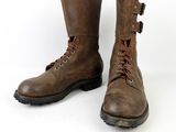pair of brown leather boots with laces on the side