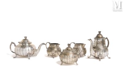 four pieces of silver tea and coffee set on a white background