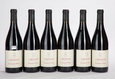 six bottles of red wine are lined up in a row