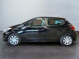 the small black car is parked in a large room