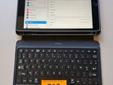 a laptop and a tablet on a table with a price tag