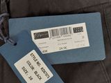 a label on a pair of pants with a tag attached to it