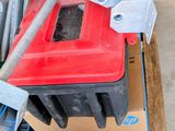 a pile of tools on a pallet in a warehouse